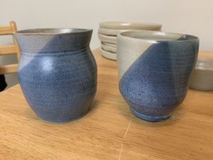 blue and white vases on wooden table