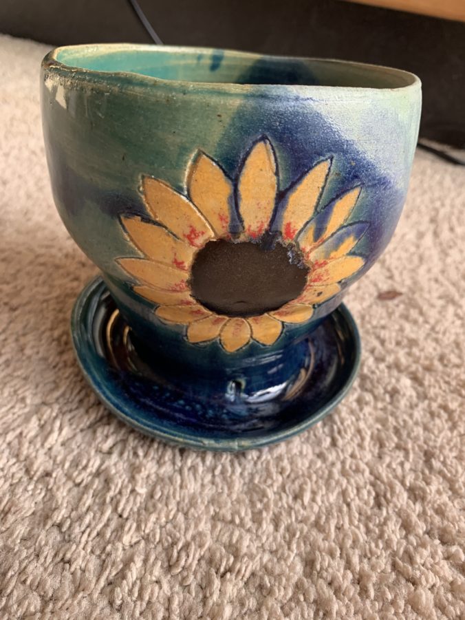 flower pot with sunflower, blue and green colouring